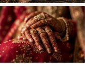 Close-up of bridal hands with detailed henna and traditional gold jewellery