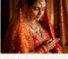 Traditional Indian bride in red zari lehenga and heritage gold jewelry